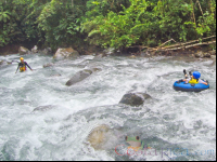 Guide Waiting To Receive A Kid In The Rapids Blue River Tubing Rincon De La Vieja
 - Costa Rica