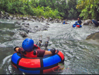 Kid On An Inner Tube Floating Toward The Currents Blue River Rincon De La Vieja
 - Costa Rica