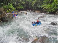 Guide Tubing Down The Currents Of Blue River To Join The Group Rincon De La Vieja
 - Costa Rica