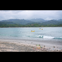        distant kayaks coming to chora island with samara beach in the background
  - Costa Rica