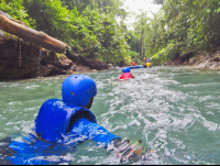 Wading In The Blue River To Get Inner Tube Rincon De La Vieja
 - Costa Rica