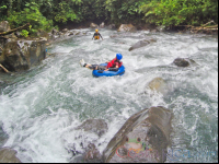 Lady Tubing On The Rocky Rapids Of Blue River Rincon De La Vieja
 - Costa Rica