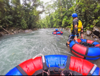 Tubing In A Section Of Calm Water Blue River Rincon De La Vieja
 - Costa Rica