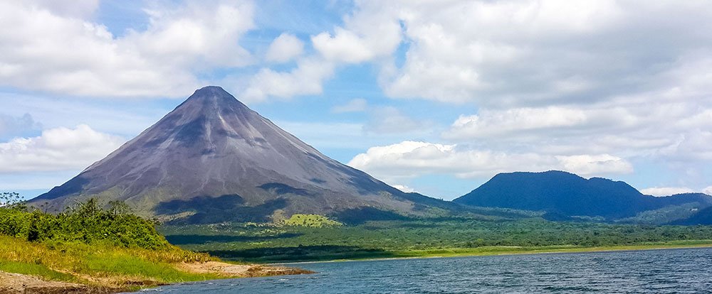        arenal volcano view from lake arenal 
  - Costa Rica